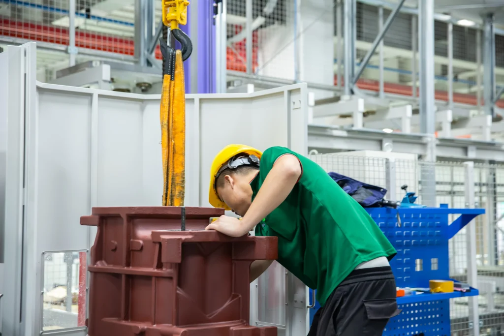 Field service technician maintaining factory air compressor